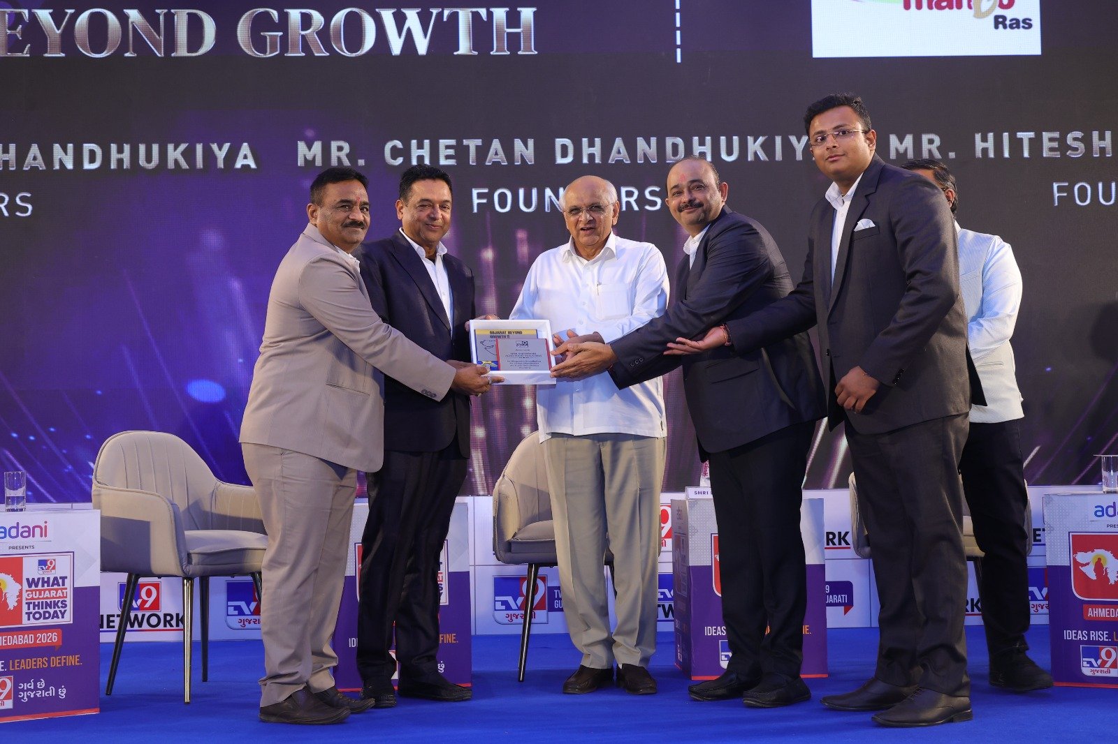 Receiving Award from CM Bhupendra Patel